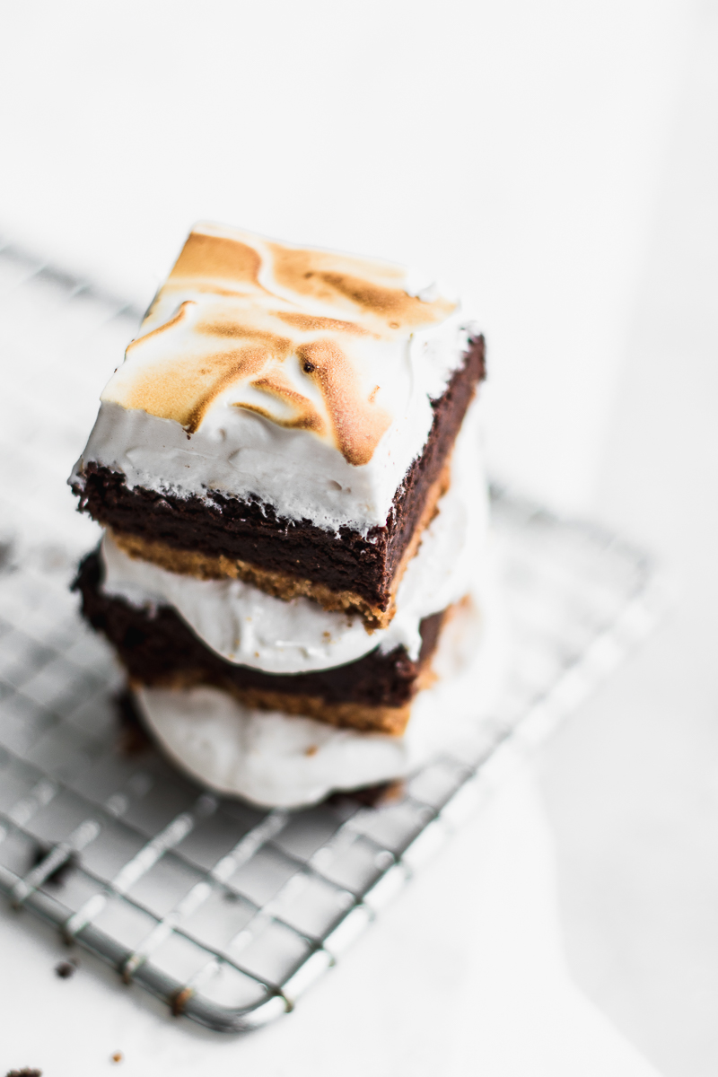 S'more brownies stacked on white background