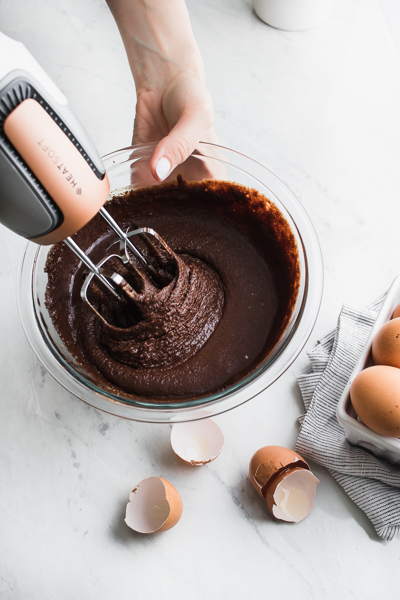 hand mixer beating chocolate batter in bowl