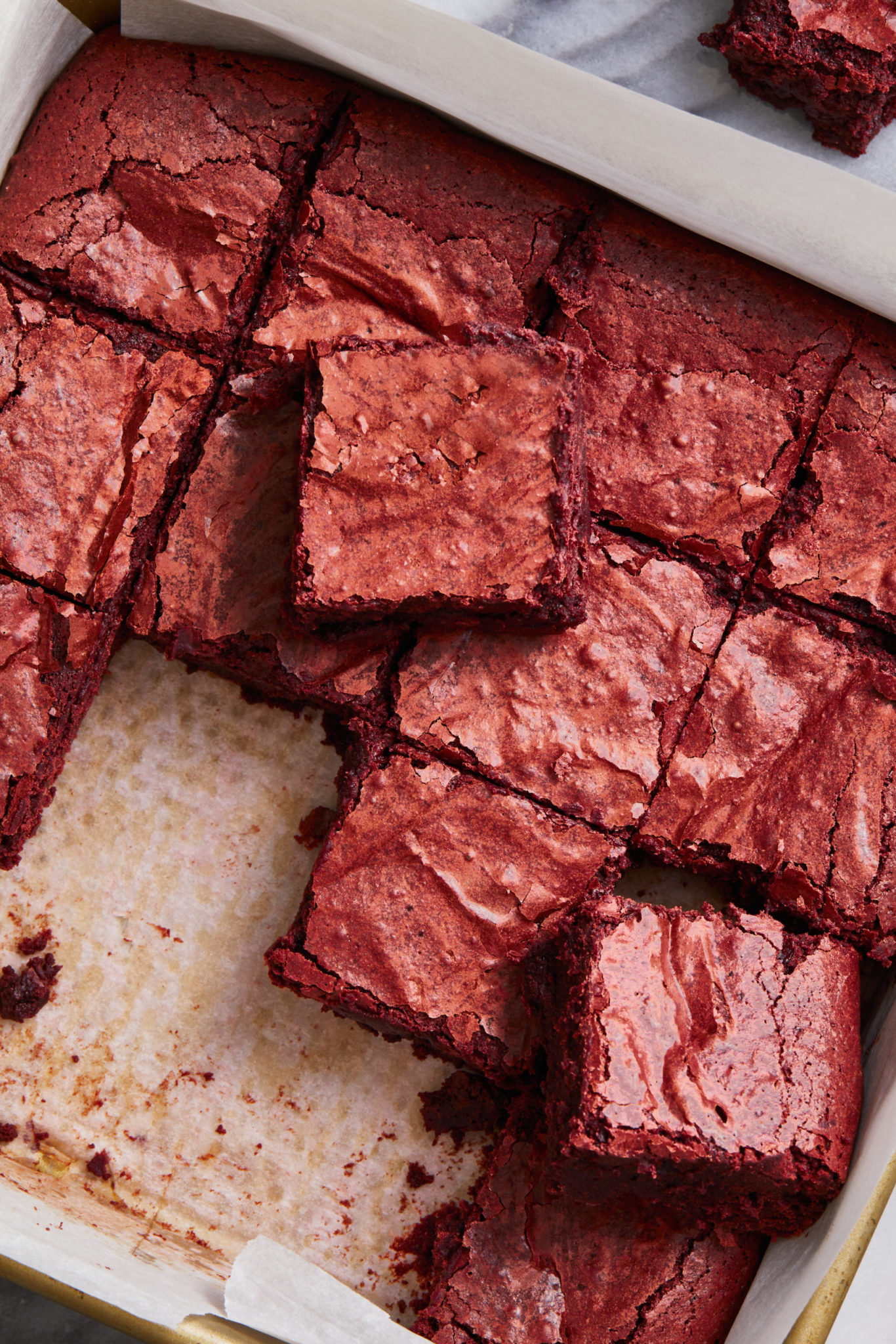 the best gluten free and dairy free red velvet brownies in a tray cut into squares
