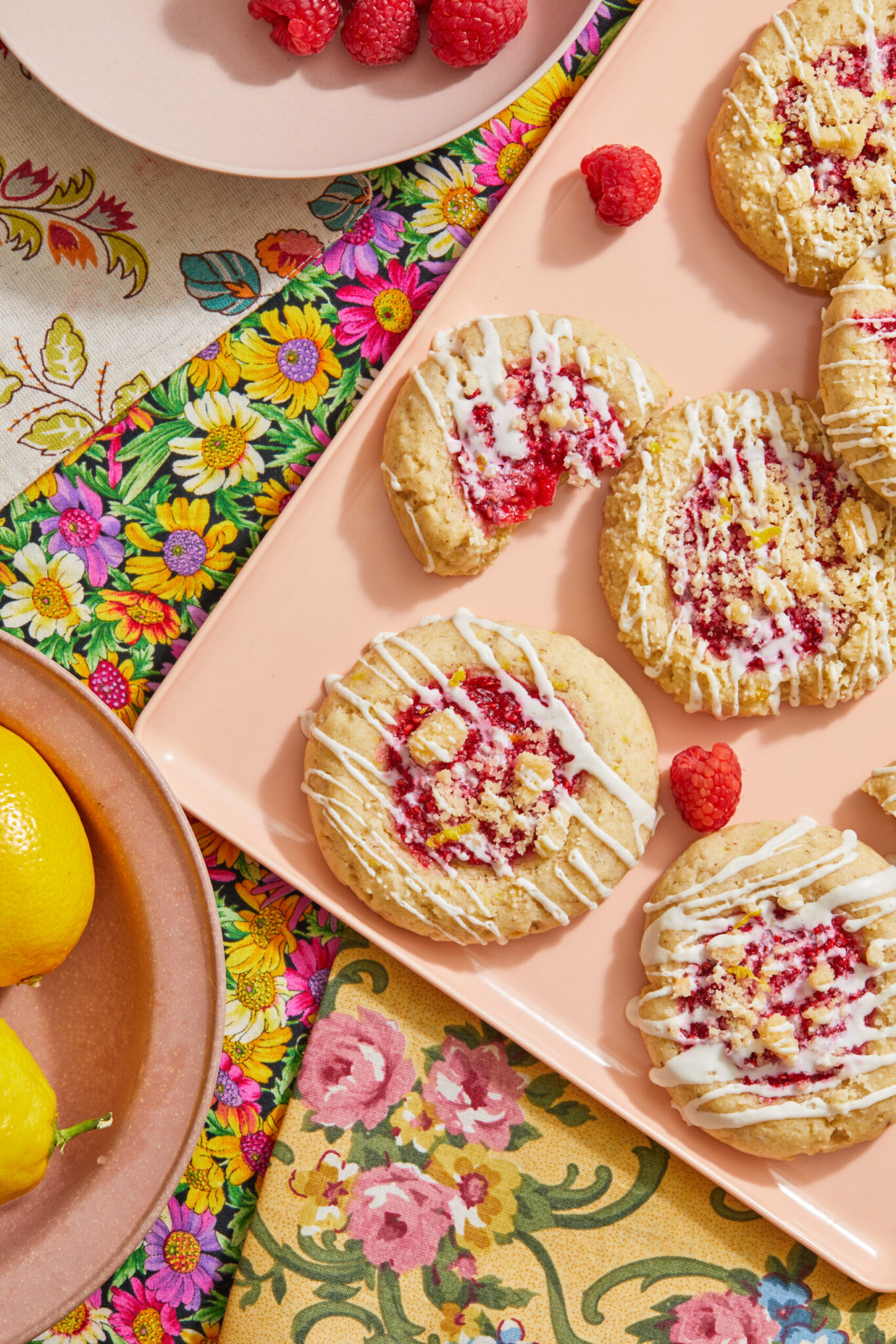 Raspberry crumble cookies on a pink backdrop