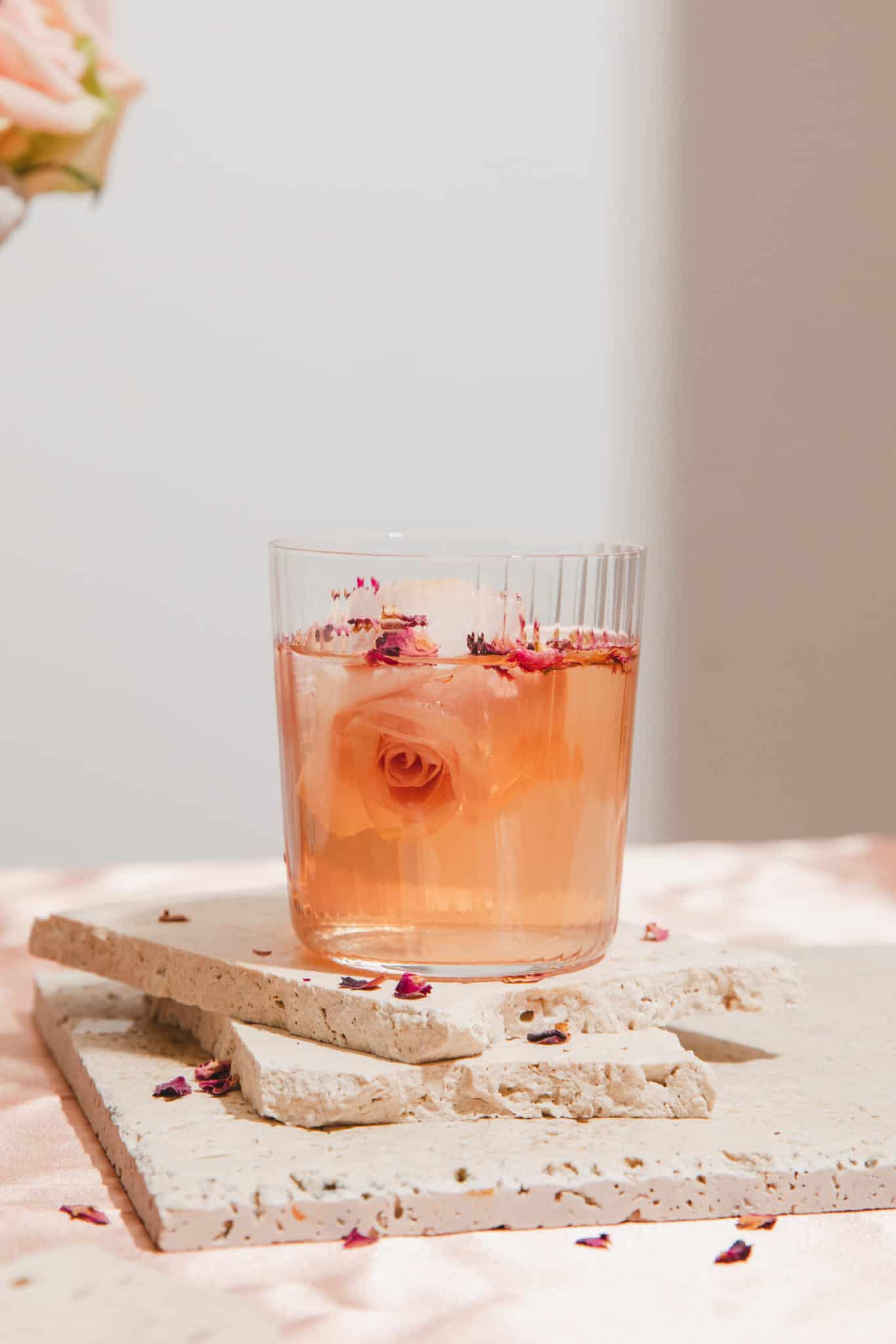 a glass of rosé margarita with rose ice cubes. A simple margarita recipe