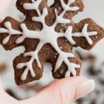 hand holding chocolate gingerbread cut out cookies