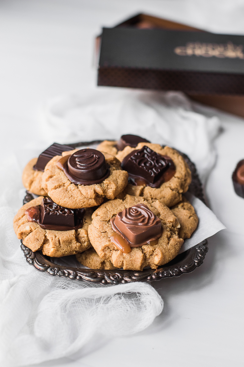 Peanut butter cookie topped with Simply Chocolate Premier Truffles.