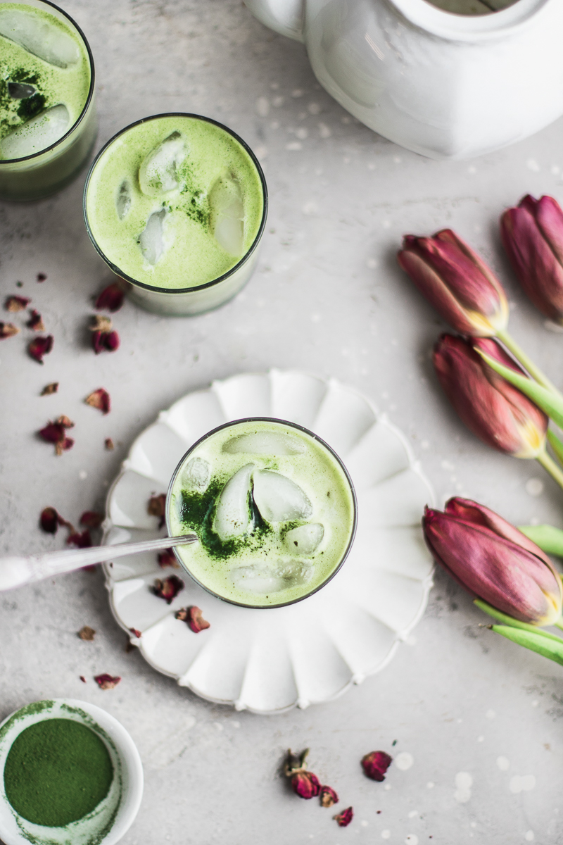 Green tea latte with rose petals and flowers