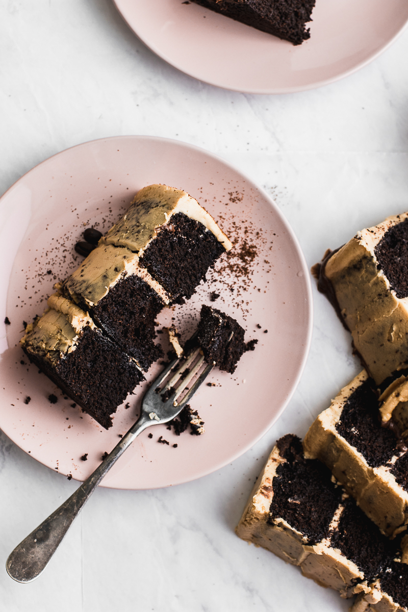 chocolate cake with espresso on marble backdrop