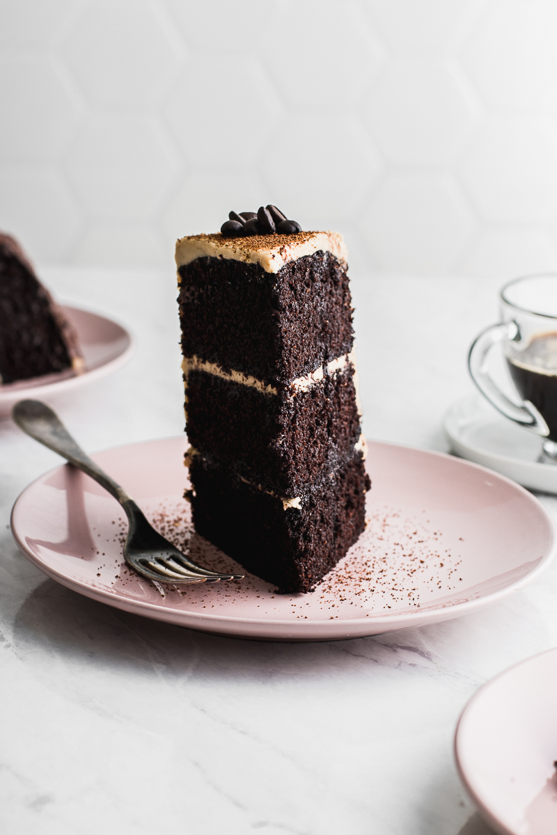 chocolate cake with espresso on marble backdrop