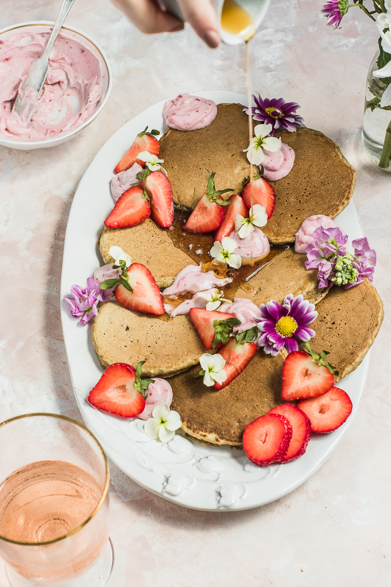pancakes on a white plate with strawberries