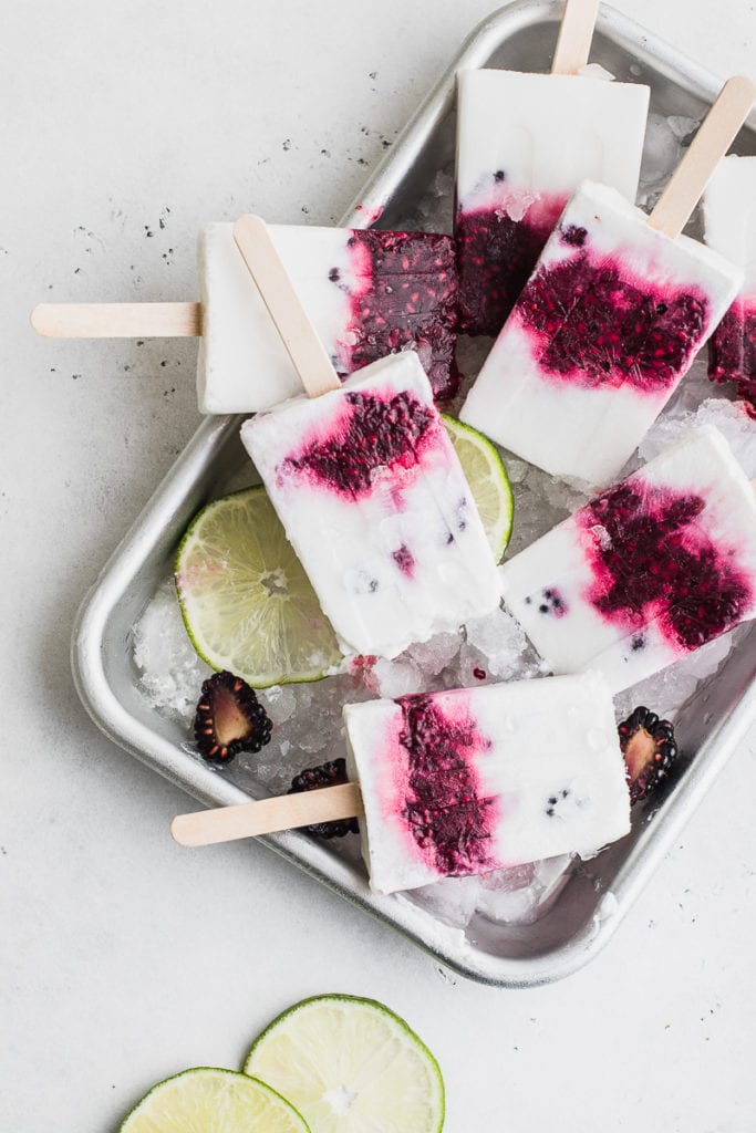 blackberry popsicles on ice with limes