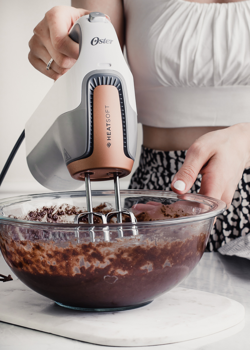 hand mixer beating chocolate batter in bowl