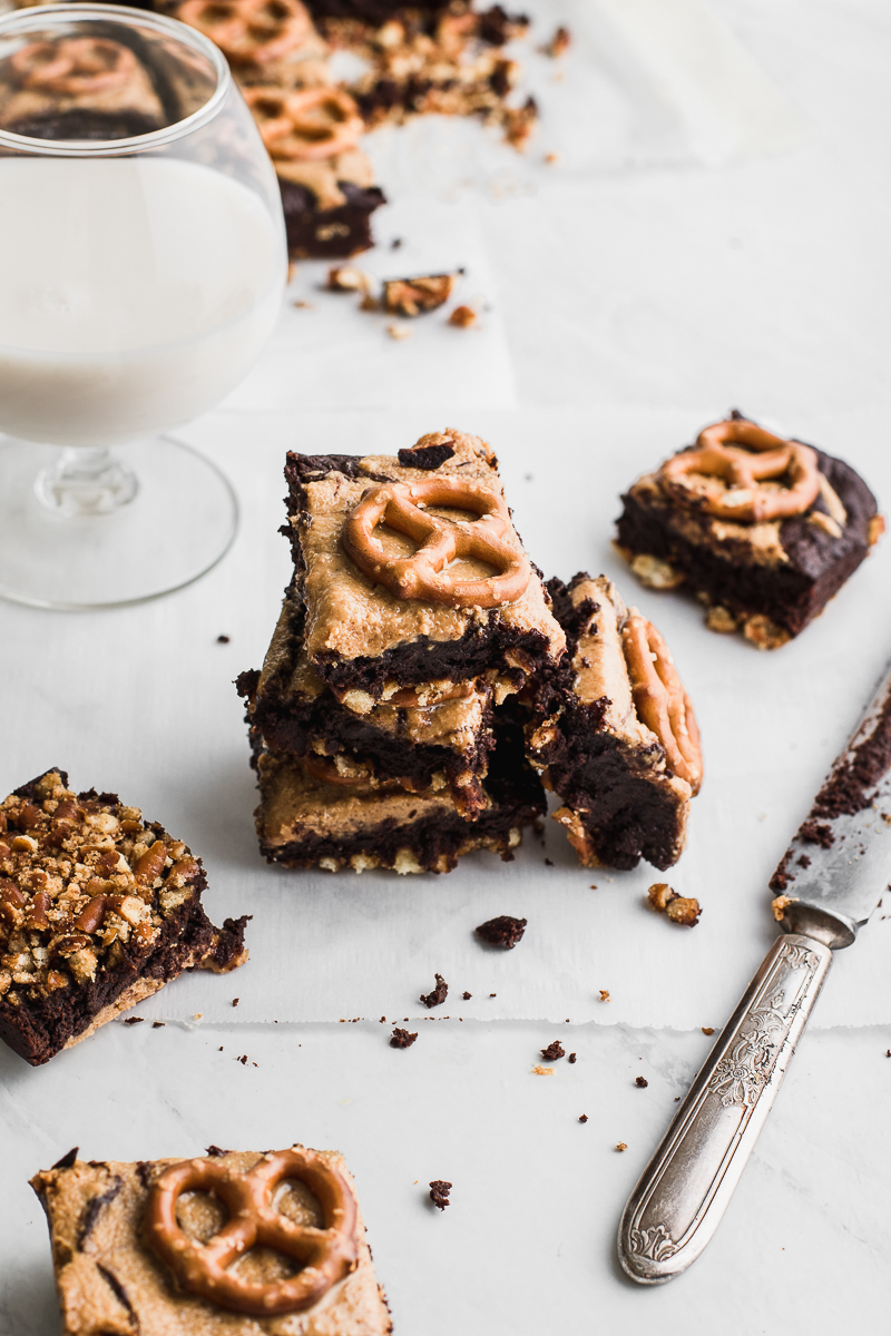  brownies stacked with pretzel and milk