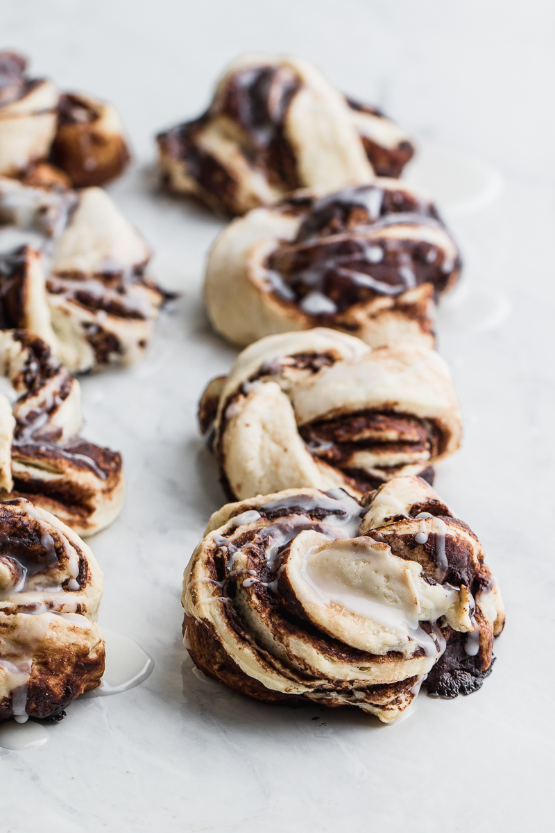 chocolate cinnamon rolls on white backdrop