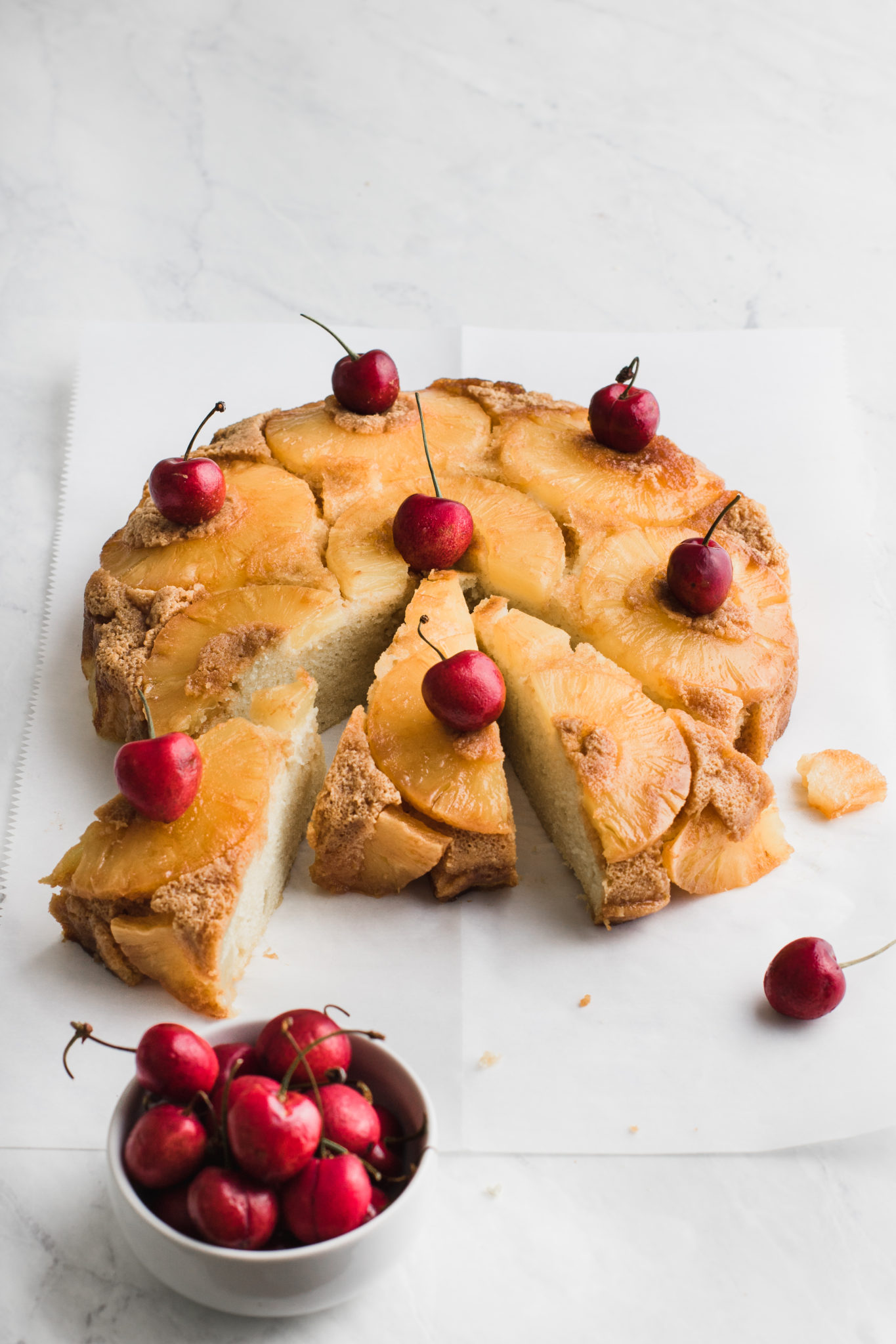 pineapple cake with cherries and sliced