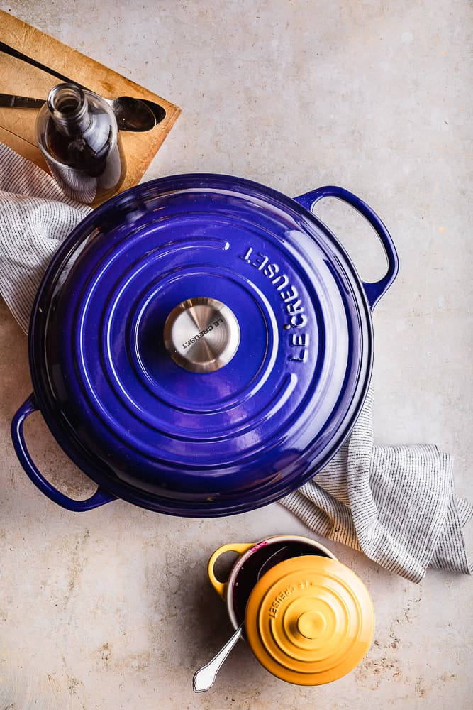 Beautiful Le Creuset kitchen ware with breakfast meal inside.