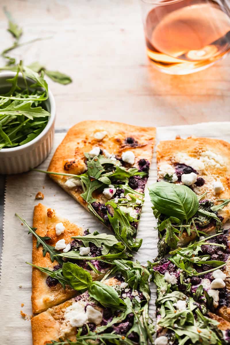Gluten free goat cheese pizza with wild blueberries. Amazing dairy free recipes. Delicious gluten free pizza.