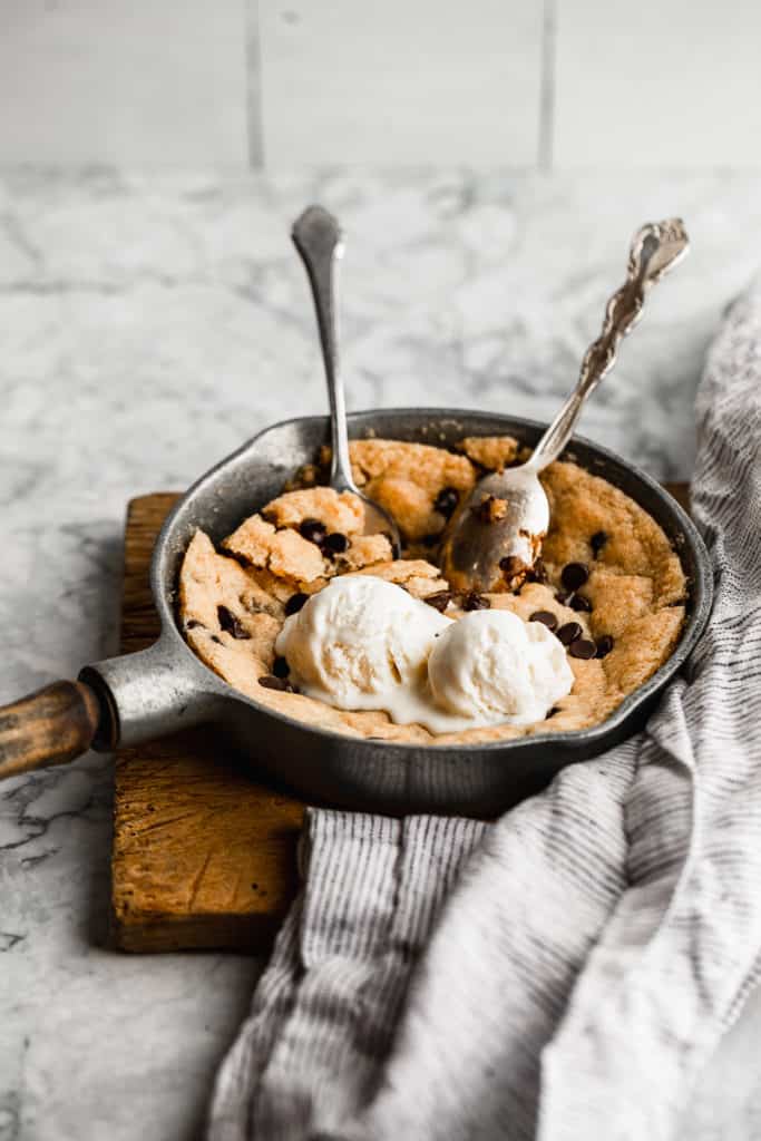 Easy skillet cookie for two on a cutting board.