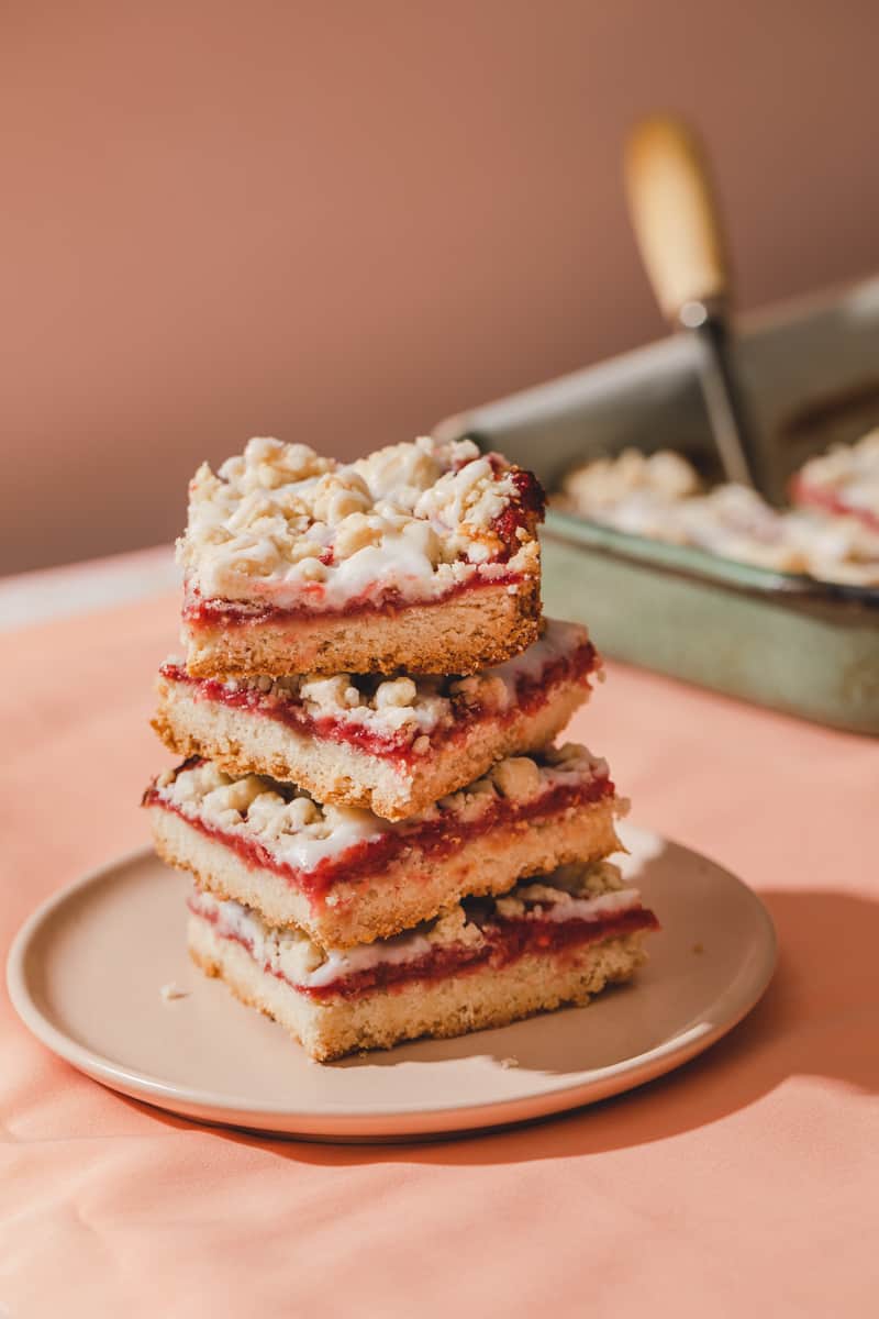 vegan strawberry cookie bars with glaze and homemade compote.