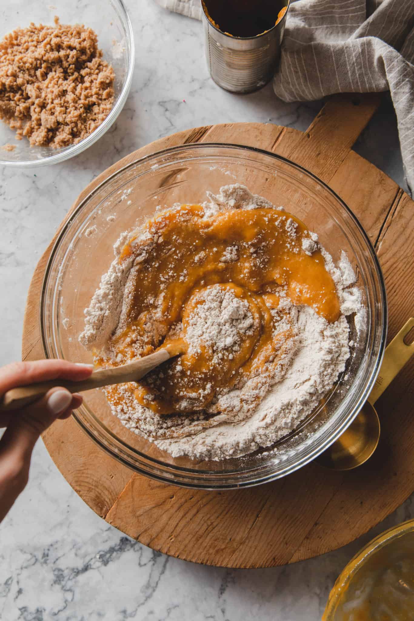 mixing together the ingredients for a Fall bread