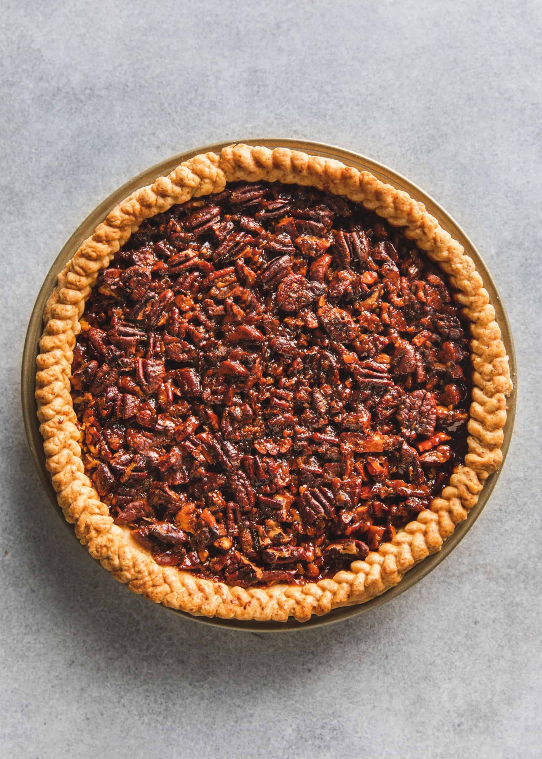The best pecan pie recipe made gluten free, vegan, egg free and dairy free with a braid crust. 