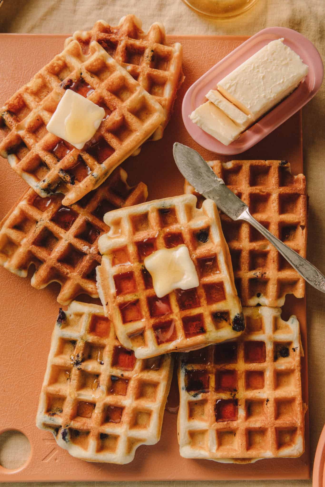 Fluffy gluten free waffle recipe. Crispy waffles with maple syrup and butter. 