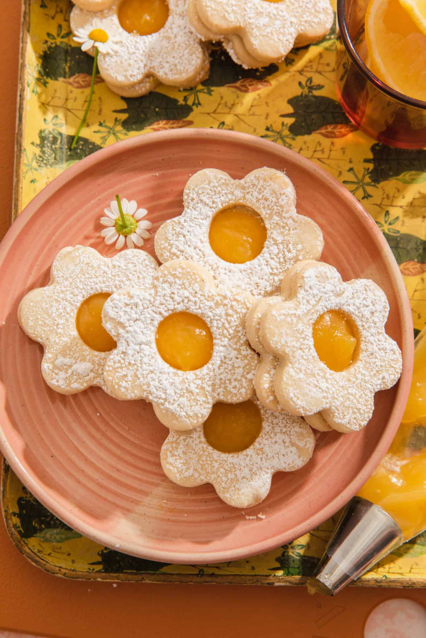 a plate of lemon curd shortbread cookies in the shape of a flower