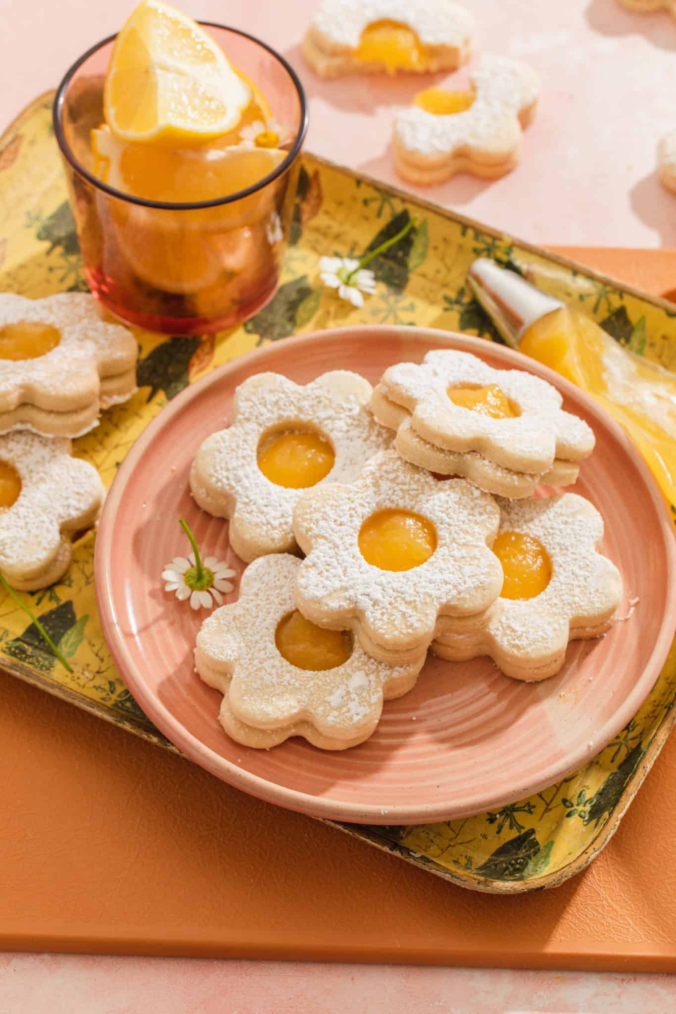a plate of lemon curd shortbread cookies in the shape of a flower