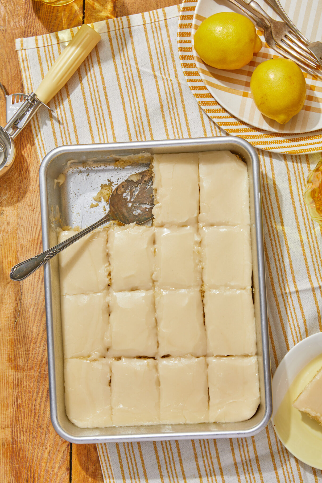 easy vegan lemon drizzle cake in a sheet pan